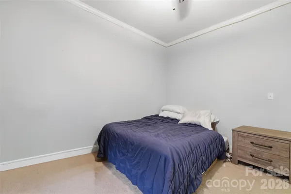 a bedroom with a bed and closet