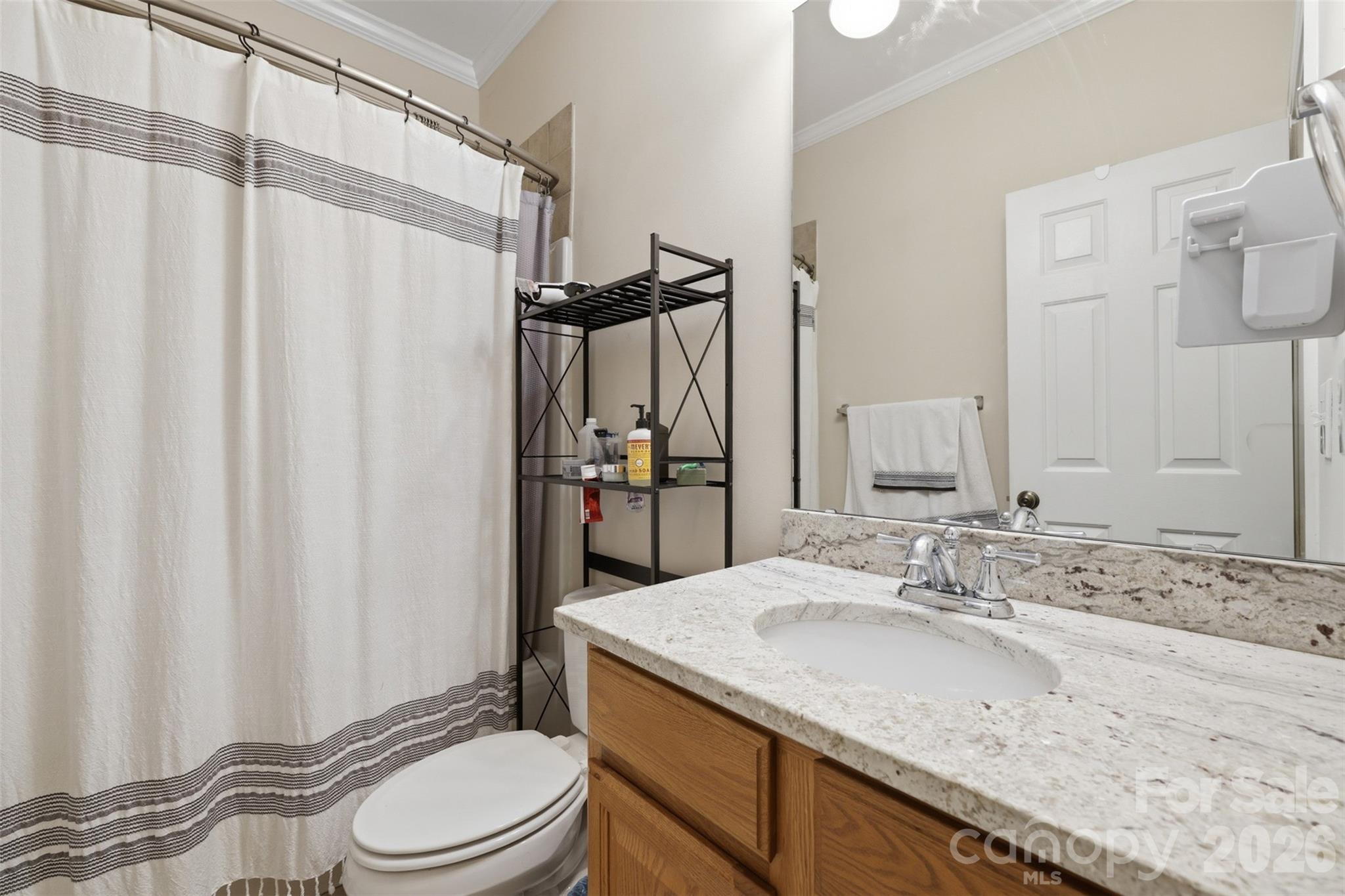 7594 Church Road Taylorsville, NC 28681 - Photo 29 of 34 a bathroom with a granite countertop sink toilet and shower