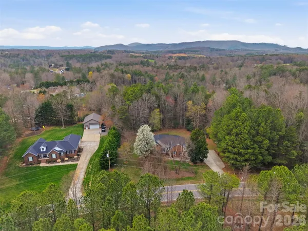 an aerial view of a house with outdoor space