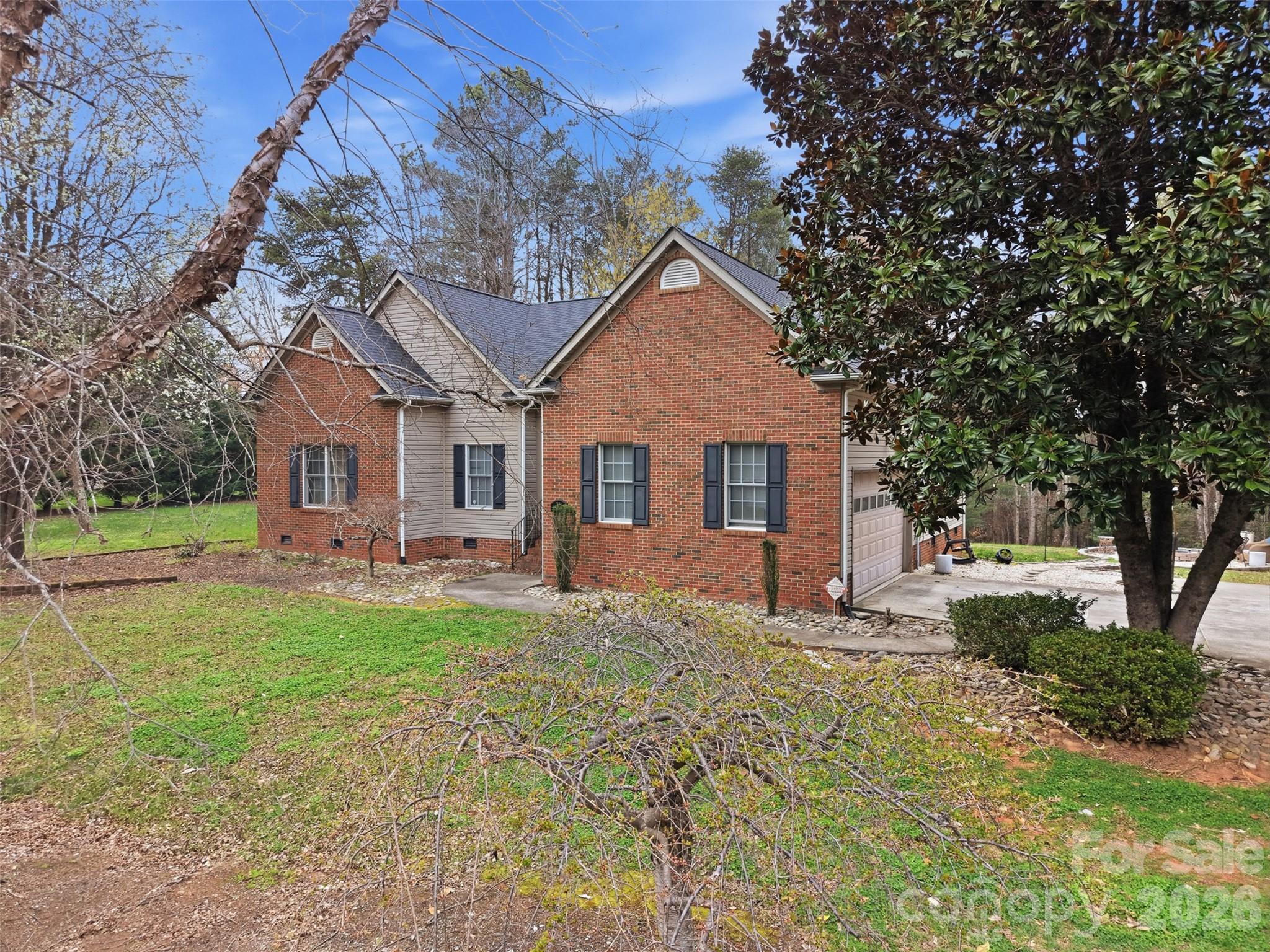 7594 Church Road Taylorsville, NC 28681 - Photo 4 of 34 a front view of a house with a yard