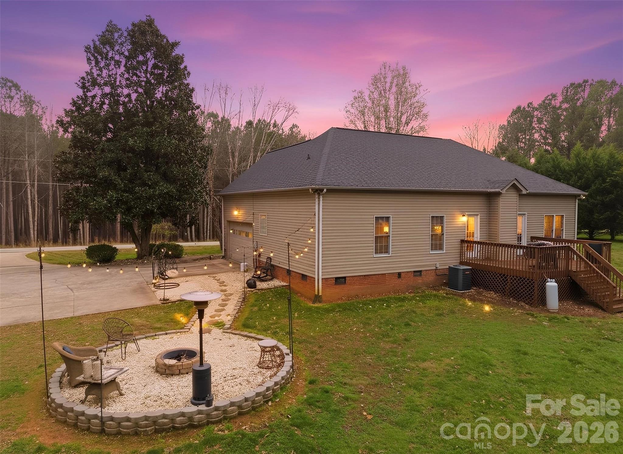 7594 Church Road Taylorsville, NC 28681 - Photo 8 of 34 a house view with a swimming pool and sitting space
