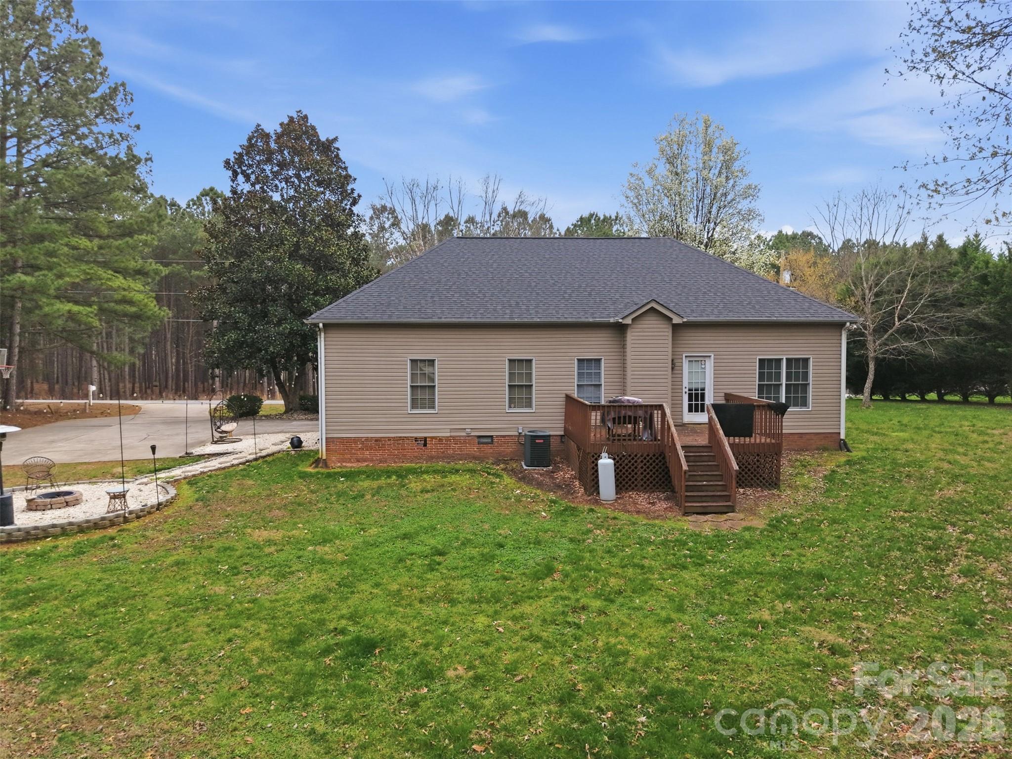 7594 Church Road Taylorsville, NC 28681 - Photo 9 of 34 a front view of a house with patio and garden