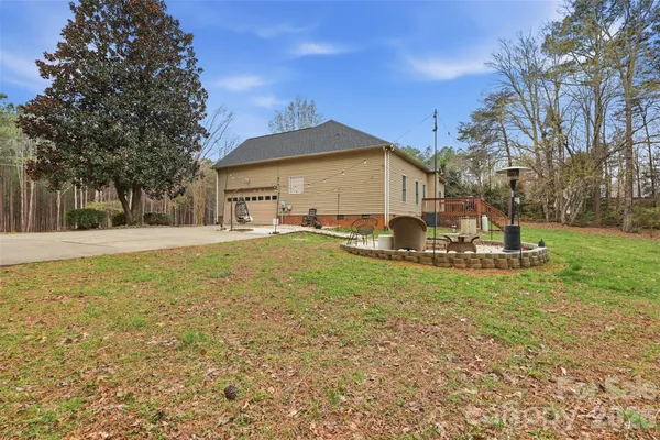 a view of a house with a backyard