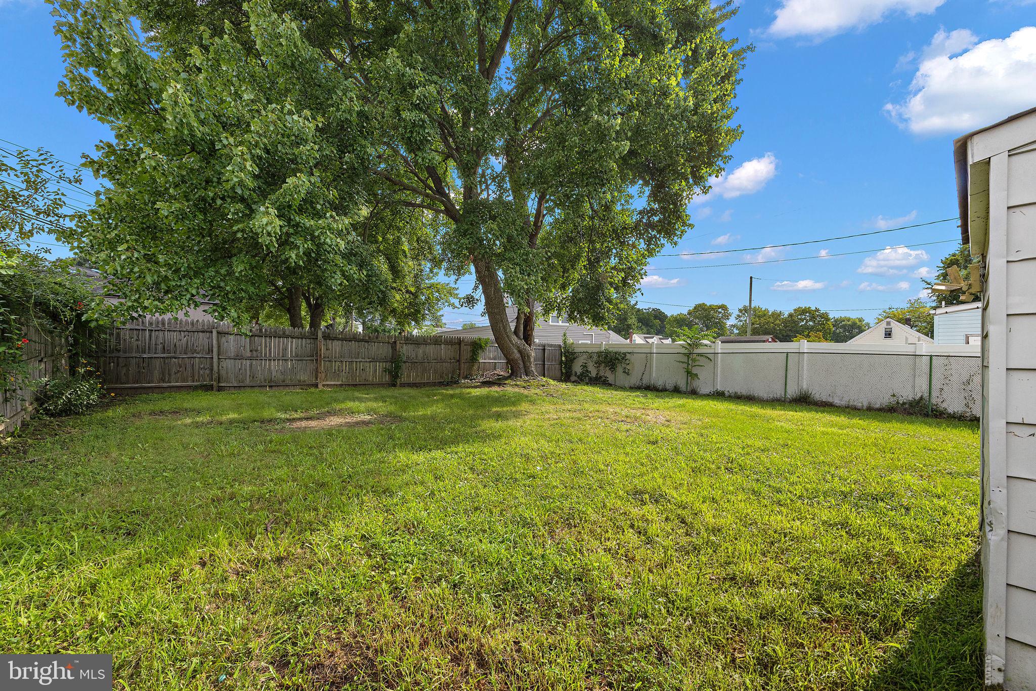 112 Vilone Road Wilmington, DE 19805 - Photo 17 of 17 Spacious backyard with lush greenery.