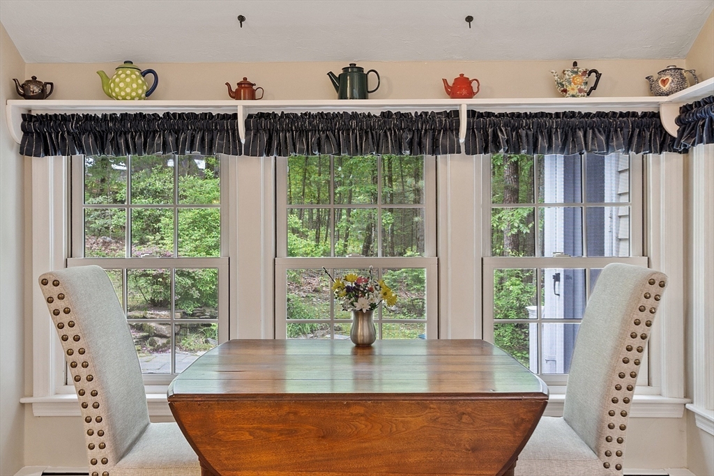 31 Spectacle Hill Road Bolton, MA 01740 - Photo 12 of 42 a view of a dining room with furniture window and wooden floor