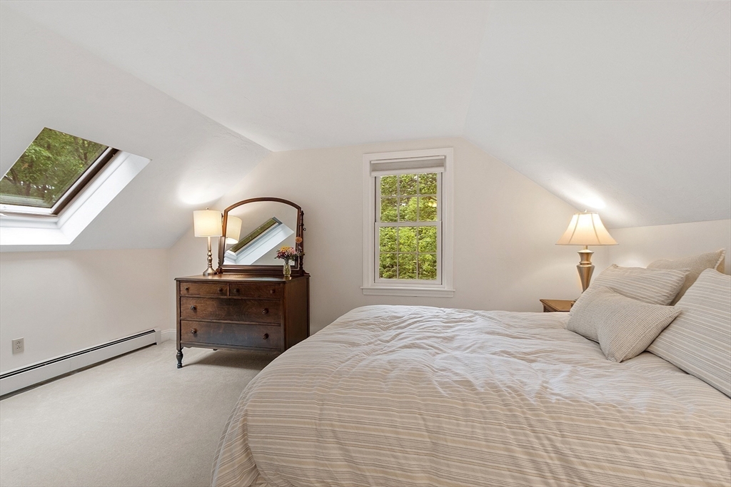 31 Spectacle Hill Road Bolton, MA 01740 - Photo 24 of 42 a bedroom with a bed table chair and a window