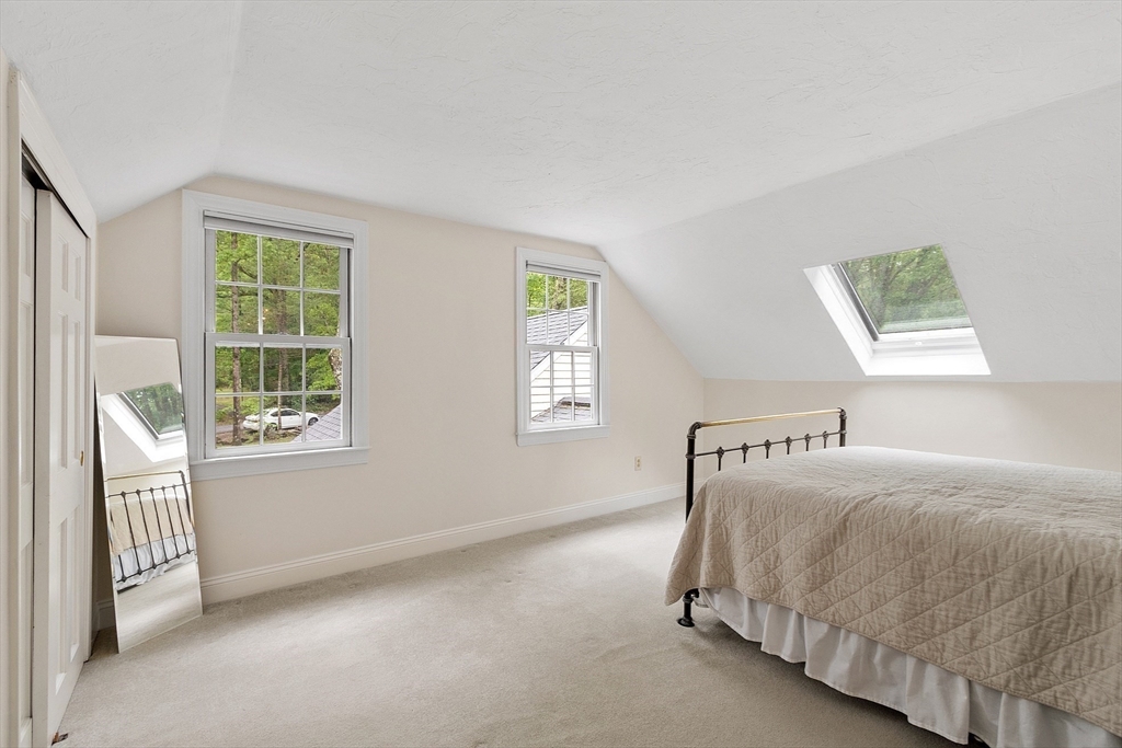 31 Spectacle Hill Road Bolton, MA 01740 - Photo 29 of 42 a bedroom with a bed and a window