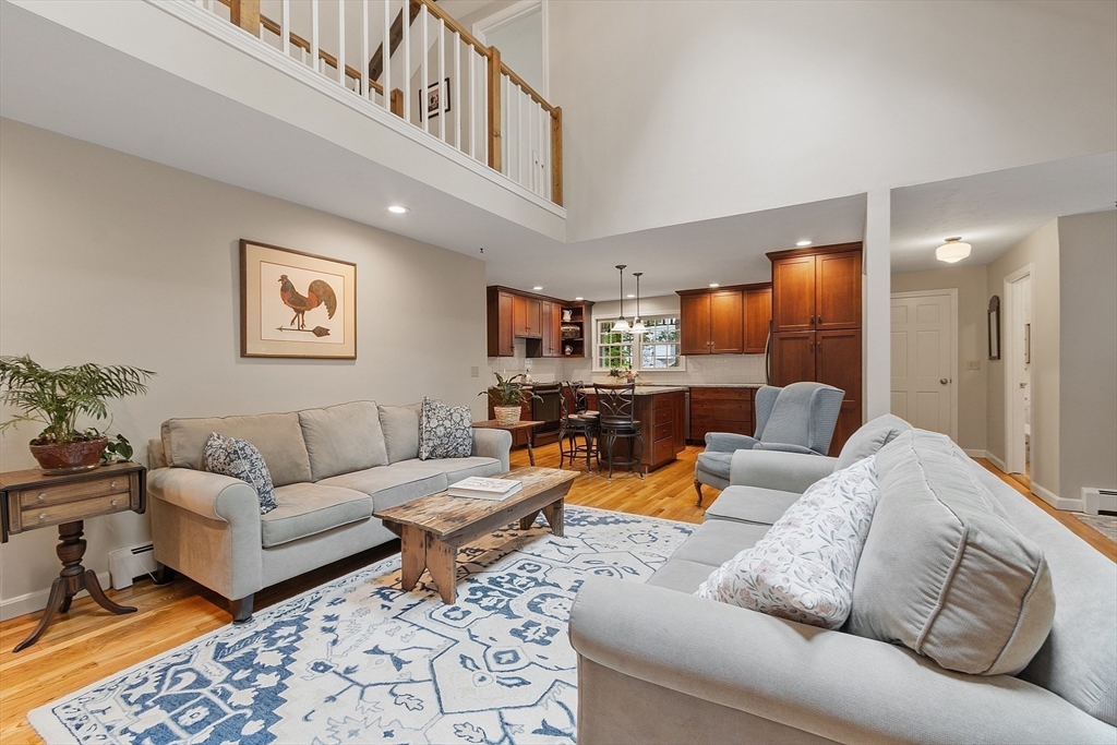 31 Spectacle Hill Road Bolton, MA 01740 - Photo 8 of 42 a living room with furniture and a view of kitchen