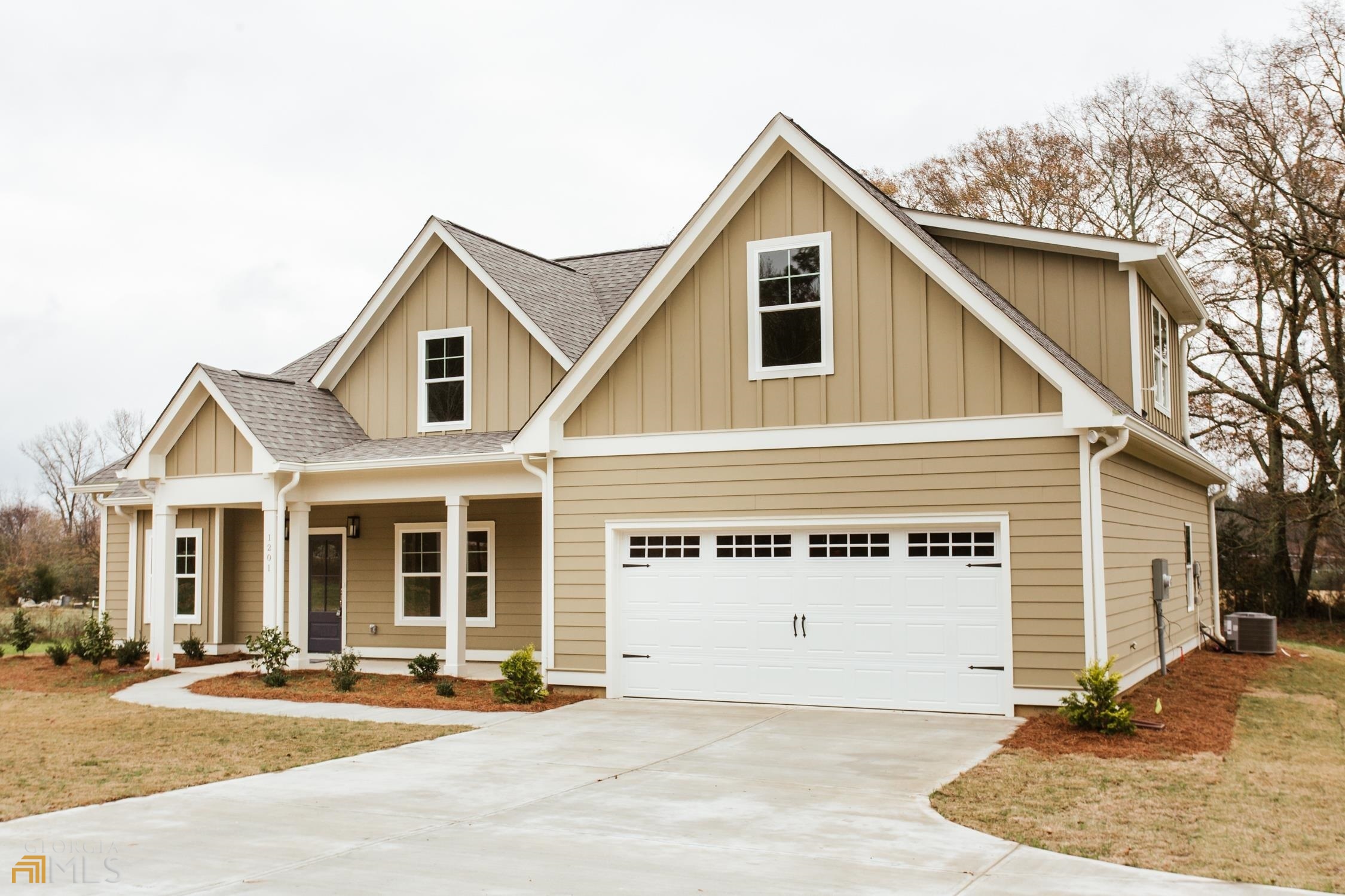 1201 High Shoals Road Bishop, GA 30621 - Photo 1 of 1 a view of a white house with large windows and palm trees