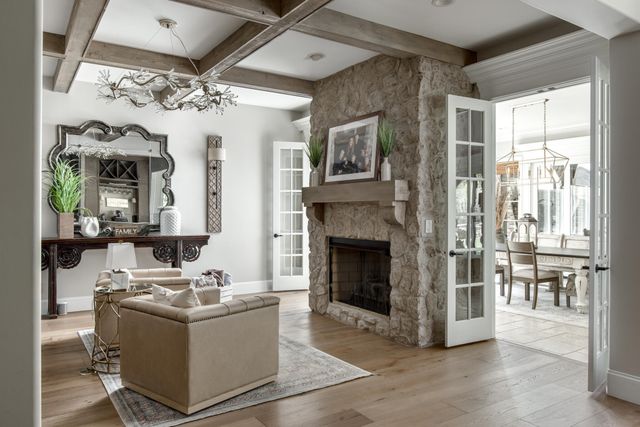 a spacious bathroom with a granite countertop sink a mirror and a shower