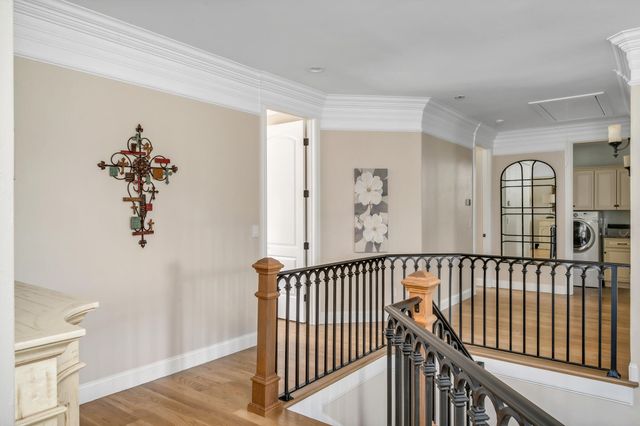a living room with furniture and a book shelf
