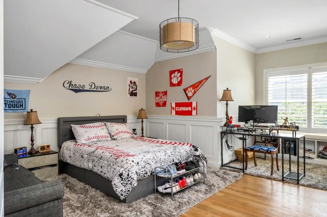 a view of a livingroom with workspace and a window