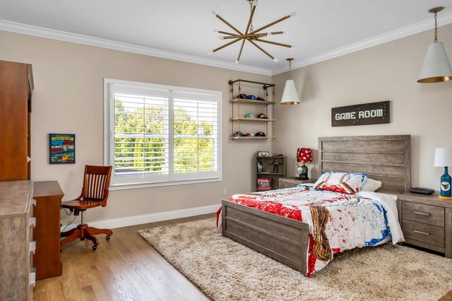 a bedroom with a bed and a walk in closet