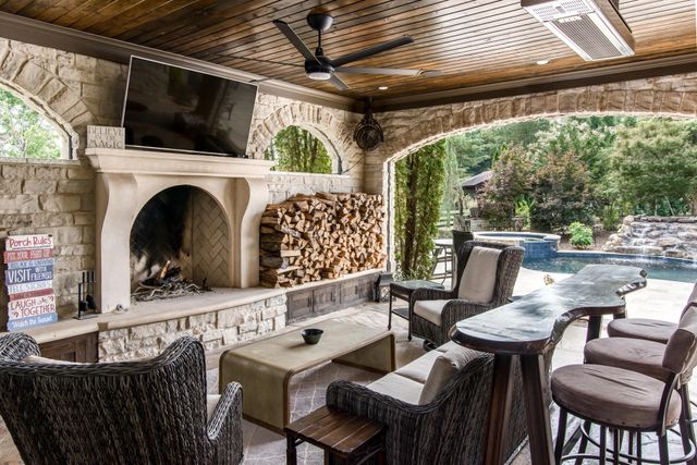 a view of kitchen with cabinets and window