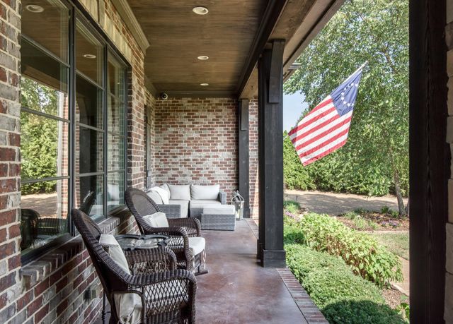 a view of an entryway with wooden floor and windows