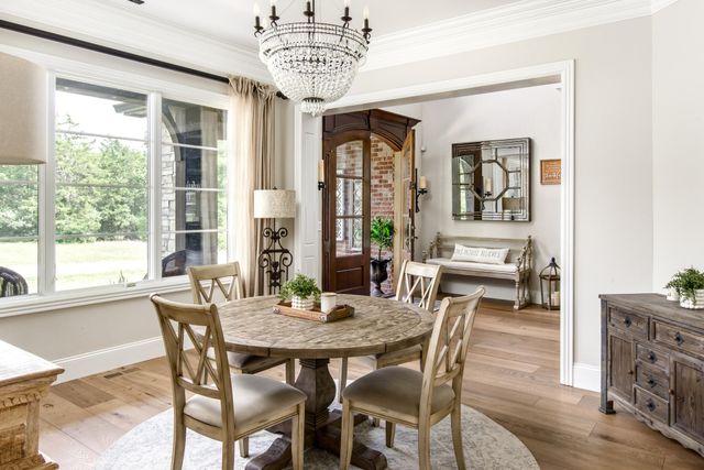 a kitchen with stainless steel appliances granite countertop a sink and a refrigerator