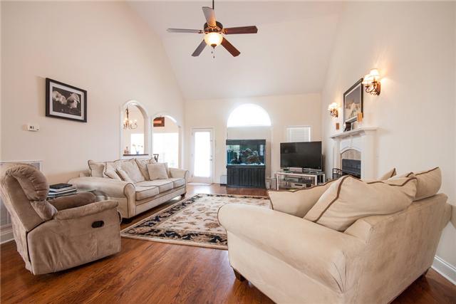 1228 White Rock Road Spring Hill, TN 37174 - Photo 5 of 20 Living room with fireplace and ceiling fan