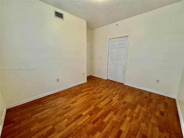a view of front door with wooden floor