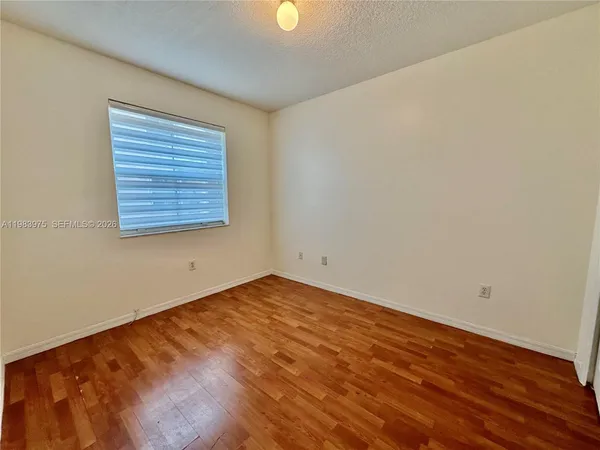 a view of a park with swings and slides