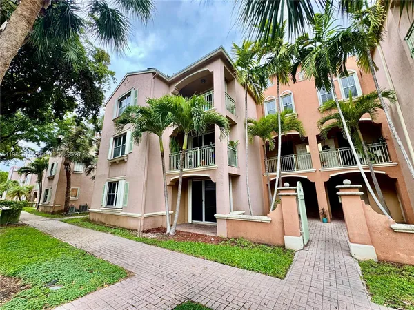 a view of a palm trees next to a house