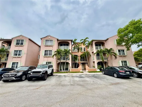 a view of a street with a building in the background