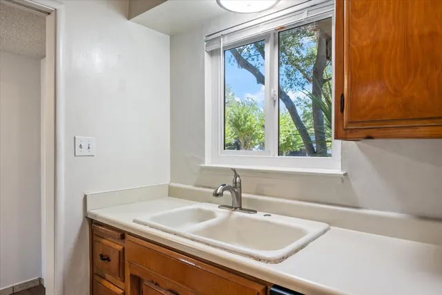 a bathroom with a sink and a window