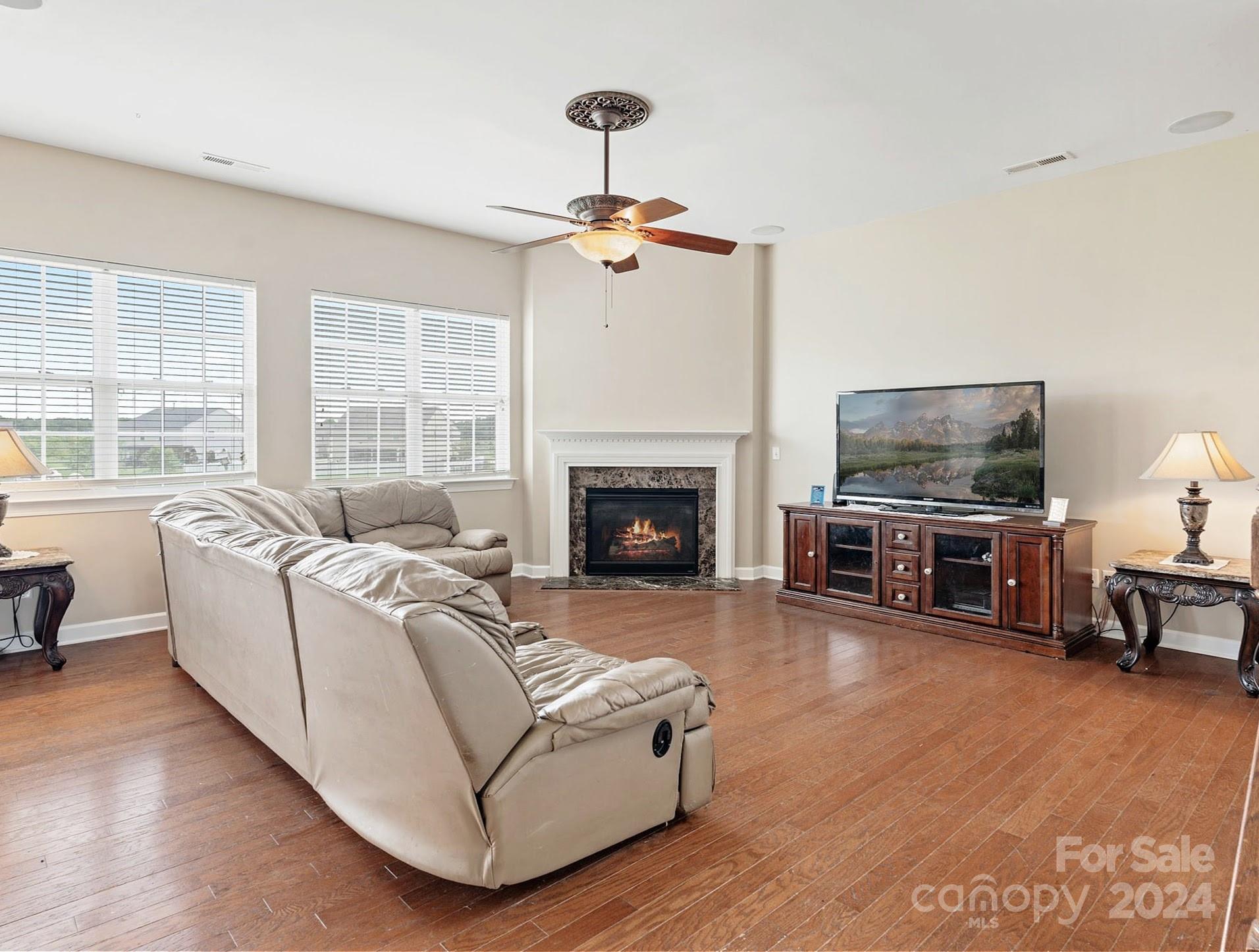 1010 Wellscroft Road Indian Trail, NC 28079 - Photo 12 of 19 a living room with furniture fireplace and flat screen tv