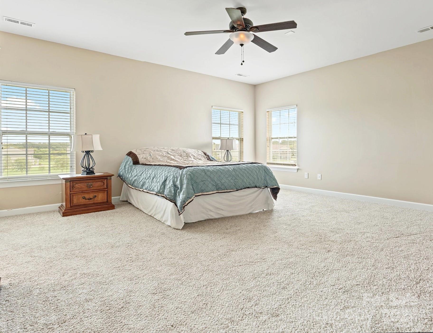 1010 Wellscroft Road Indian Trail, NC 28079 - Photo 15 of 19 a spacious bedroom with a bed and window
