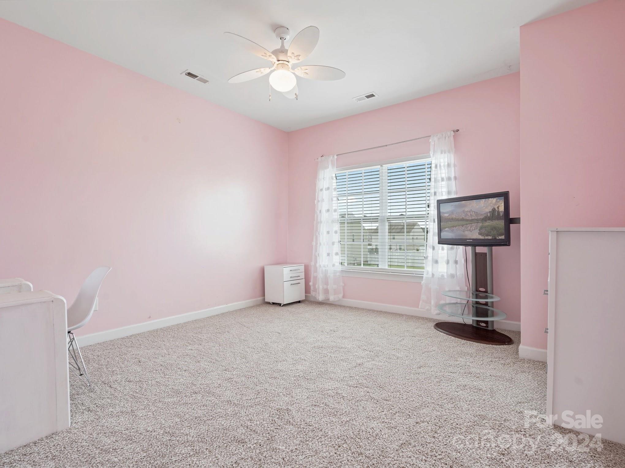 1010 Wellscroft Road Indian Trail, NC 28079 - Photo 16 of 19 a view of empty room with a fireplace and window