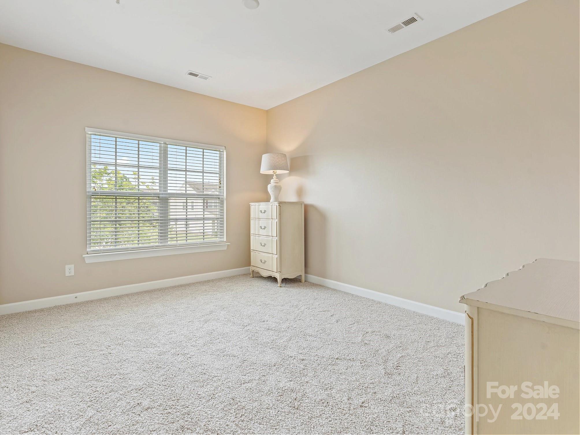 1010 Wellscroft Road Indian Trail, NC 28079 - Photo 17 of 19 an empty room with windows