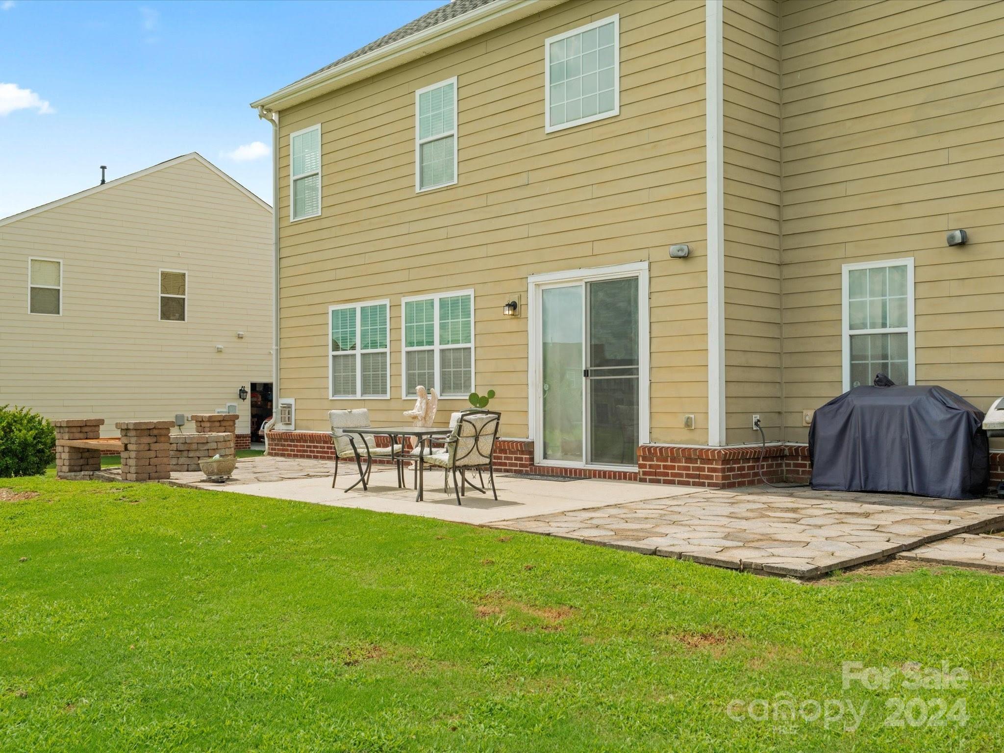 1010 Wellscroft Road Indian Trail, NC 28079 - Photo 19 of 19 a view of a backyard with a patio and a garden