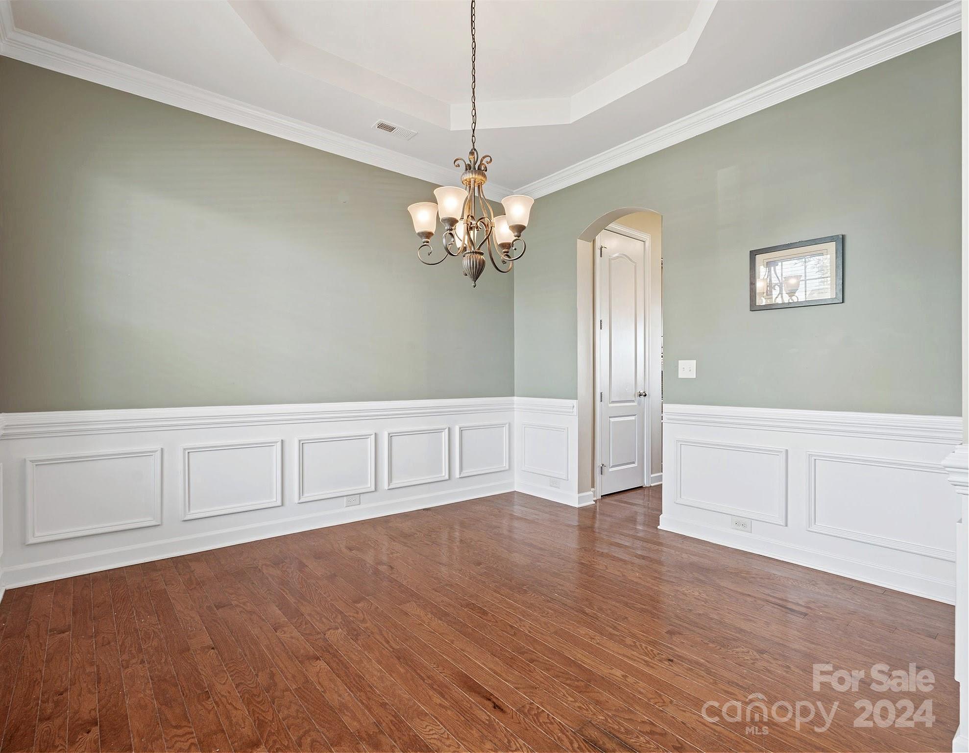 1010 Wellscroft Road Indian Trail, NC 28079 - Photo 5 of 19 a view of an empty room with window and wooden floor
