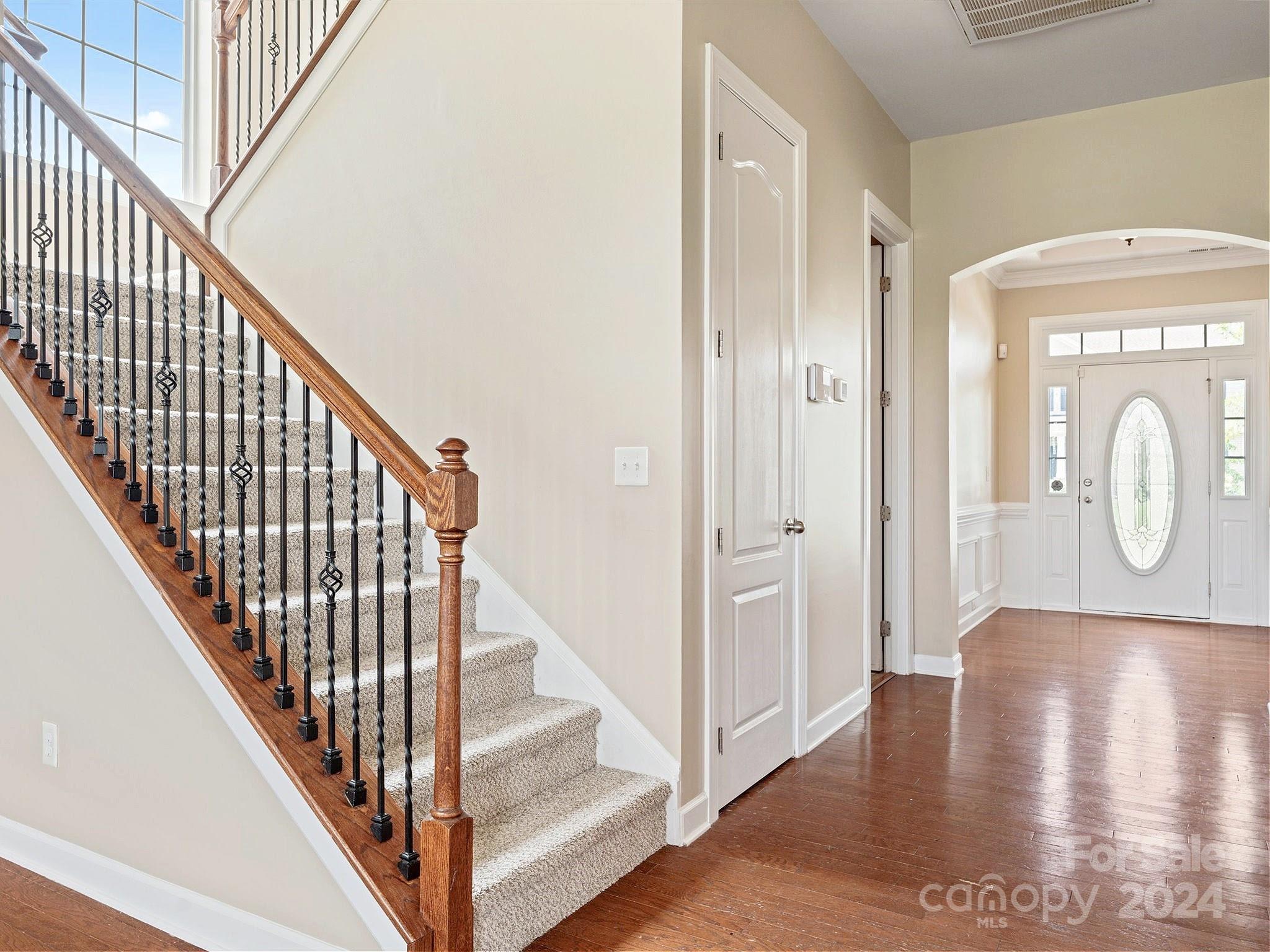 1010 Wellscroft Road Indian Trail, NC 28079 - Photo 6 of 19 a view of a hallway with wooden floor and staircase
