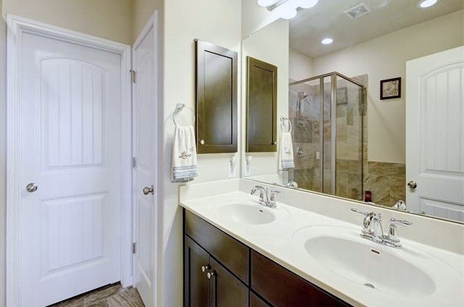 14001 Avery Ranch Boulevard, Unit 801 Austin, TX 78717 - Photo 7 of 26 Double vanity sinks and a spacious shower offer practical elegance in this private bath.