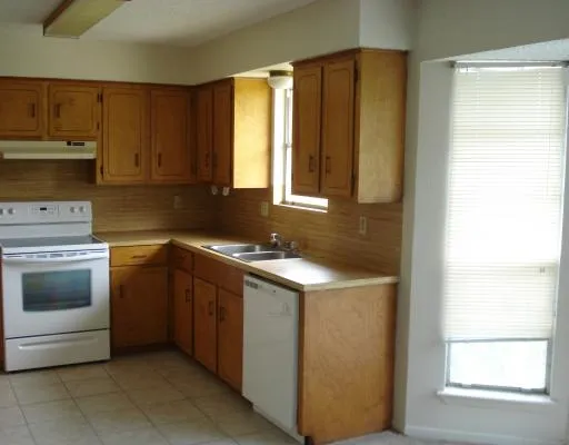 a kitchen with a stove and a sink