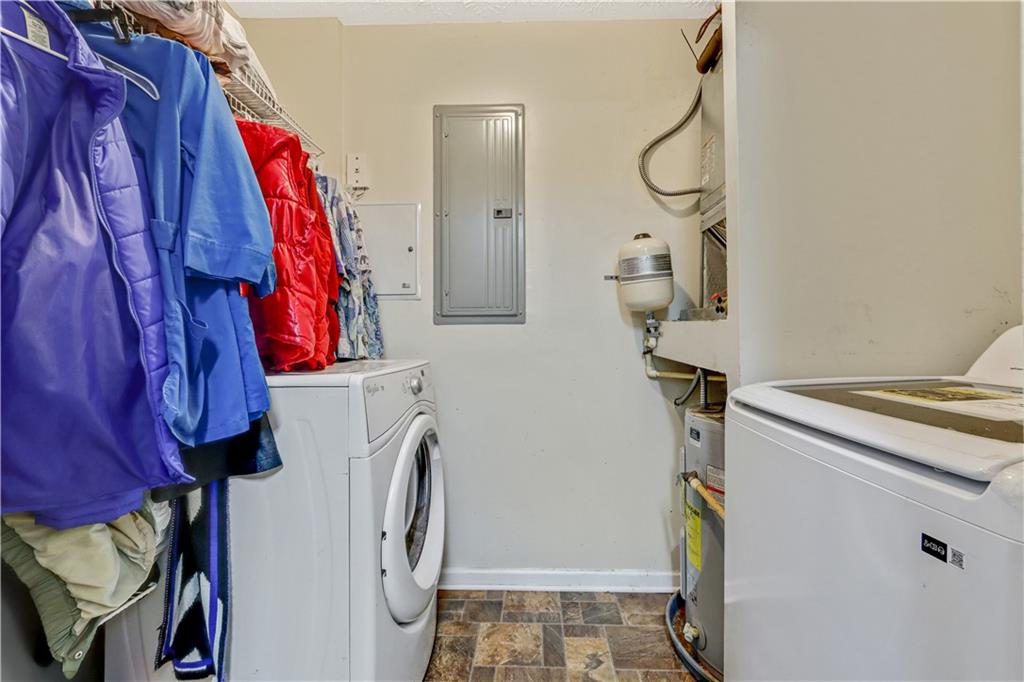 12303 Waldrop Place Decatur, GA 30034 - Photo 8 of 11 a view of walk in closet with clothes and shoes