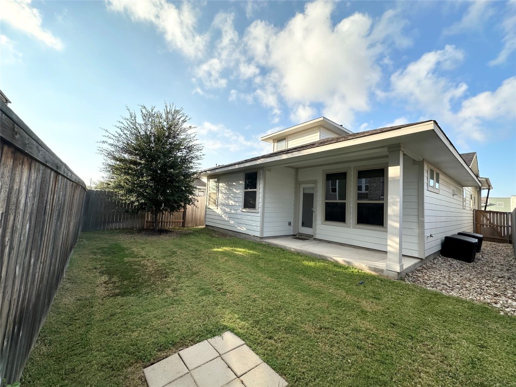 8600 Cumbrae Lane Austin, TX 78744 - Photo 15 of 29 Back of property featuring a patio and a fenced in backyard