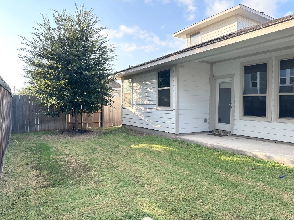 8600 Cumbrae Lane Austin, TX 78744 - Photo 20 of 29 View of yard featuring a patio and fenced in backyard