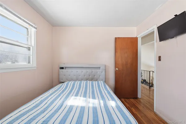 a view of a room with wooden floor