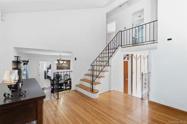 a view of entryway with livingroom and wooden floor