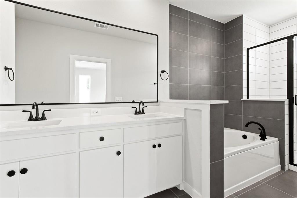 2020 Aldrich Road Celina, TX 75009 - Photo 24 of 40 a bathroom with a bathtub and a sink