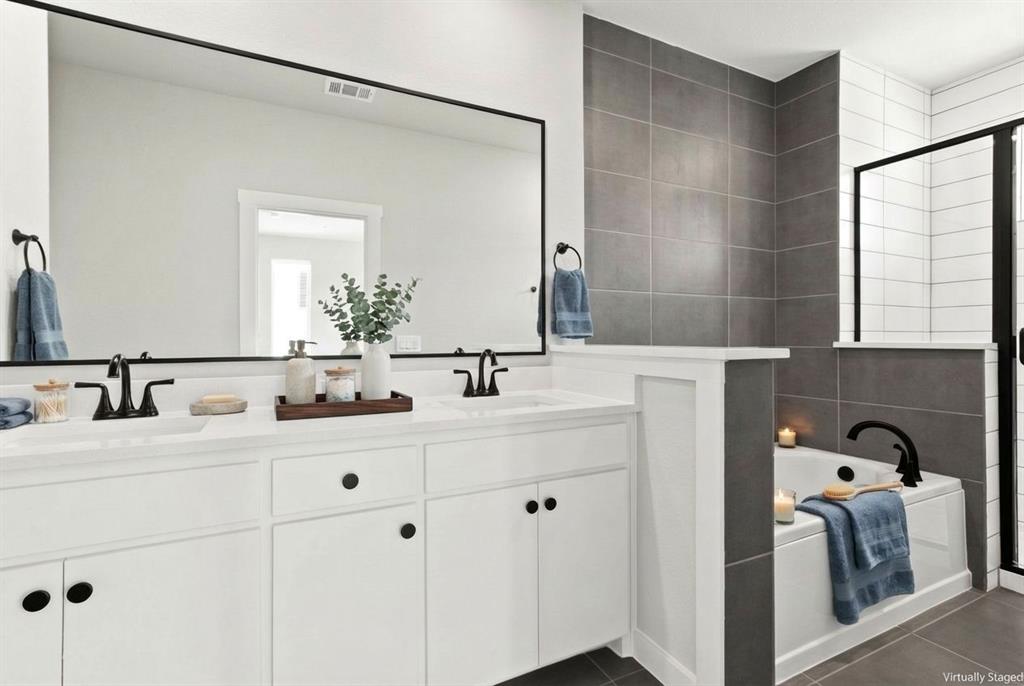2020 Aldrich Road Celina, TX 75009 - Photo 26 of 40 a bathroom with a double vanity sink and mirror