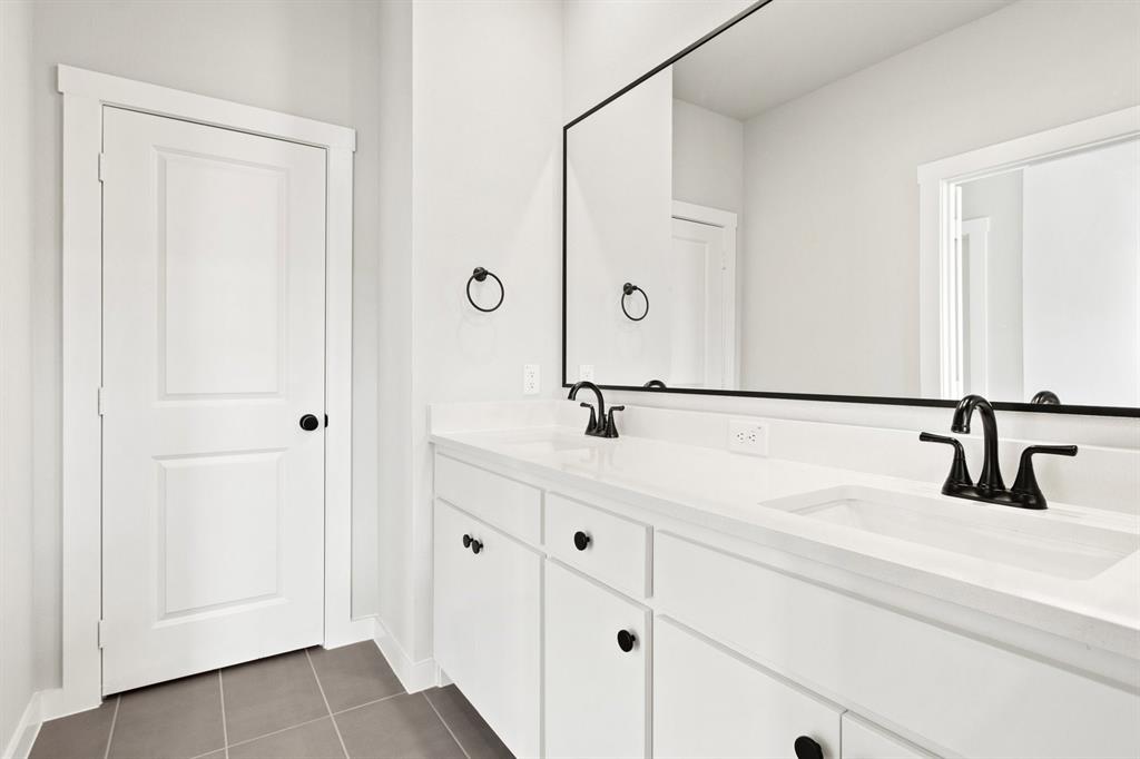 2020 Aldrich Road Celina, TX 75009 - Photo 27 of 40 a bathroom with a sink and a mirror