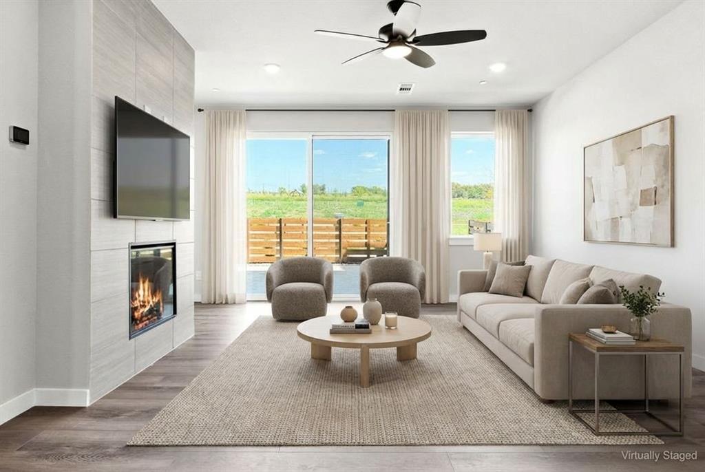 2020 Aldrich Road Celina, TX 75009 - Photo 10 of 40 a living room with furniture and a fireplace