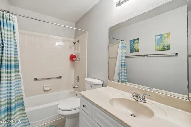 a view of a livingroom with a ceiling fan and a window