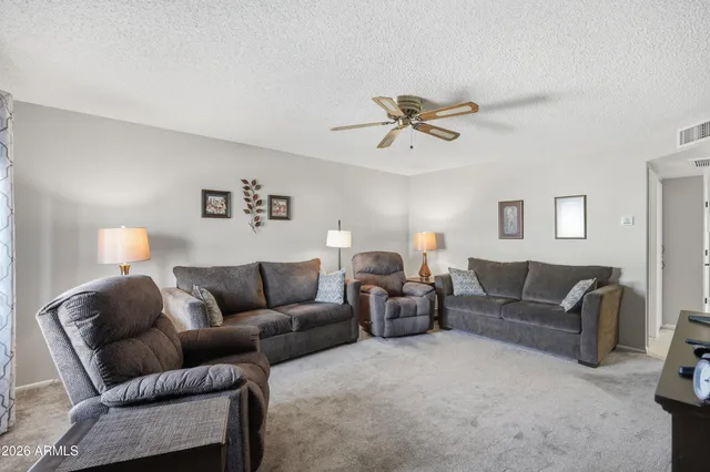 a view of a patio with a table and chairs