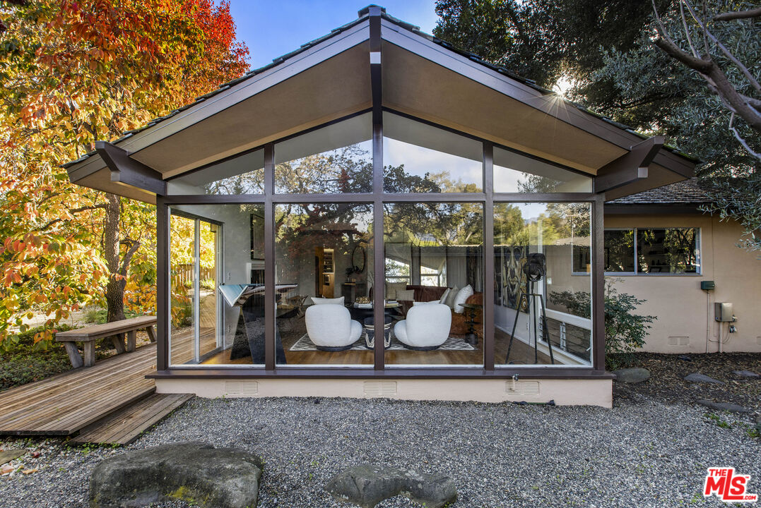 921 North San Marcos Road Santa Barbara, CA 93111 - Photo 1 of 44 a table and chairs in front of a house
