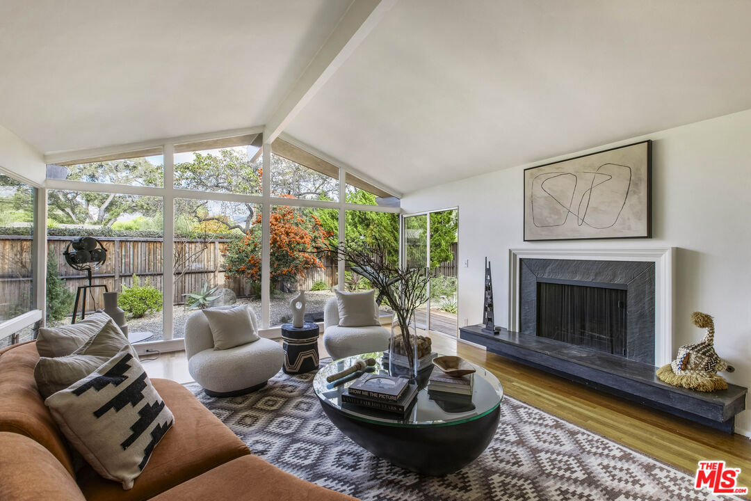 921 North San Marcos Road Santa Barbara, CA 93111 - Photo 13 of 44 a living room with furniture and a fireplace
