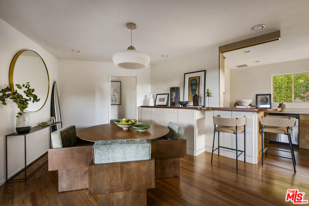 921 North San Marcos Road Santa Barbara, CA 93111 - Photo 16 of 44 a living room with kitchen island furniture and a chandelier