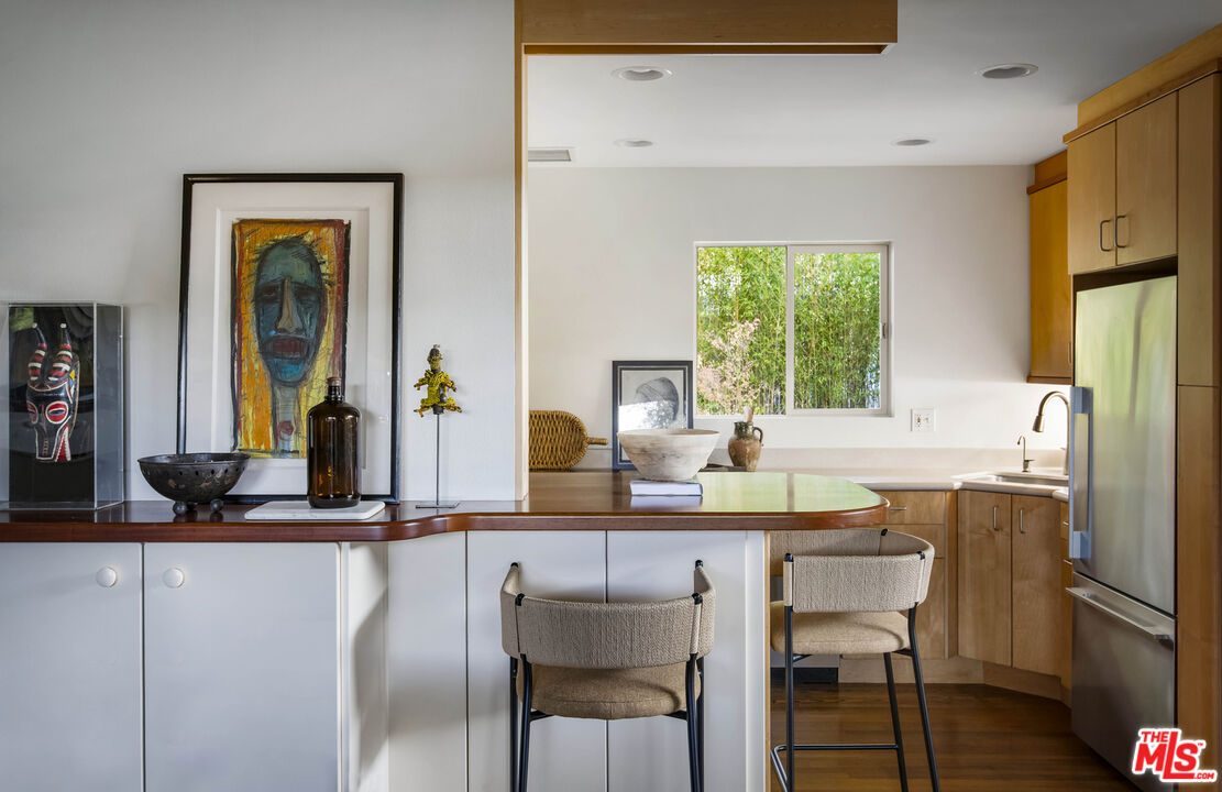 921 North San Marcos Road Santa Barbara, CA 93111 - Photo 18 of 44 a dining hall with stainless steel appliances granite countertop a dining table and chairs